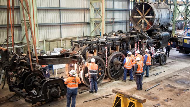 Workers restore the 3801 steam train. Supplied: Transport Heritage NSW