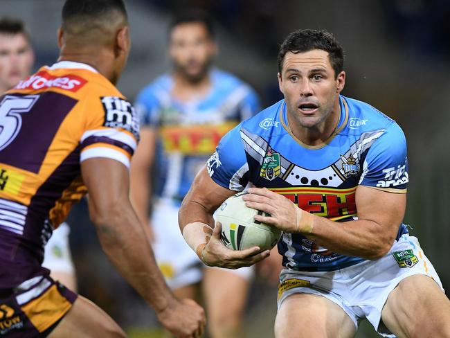 Michael Gordon of the Titans (right) runs with the ball during the Round 17 NRL match between the Gold Coast Titans and the Brisbane Broncos at Cbus Super Stadium in Robina on the Gold Coast. Sunday, July 8, 2018. (AAP Image/Dave Hunt) NO ARCHIVING, EDITORIAL USE ONLY