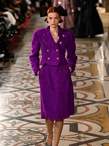 A model walks the runway, hair bow in place, during the Chanel Haute Couture Fall/Winter 2024-2025 show in June 2024. Picture: Kristy Sparow