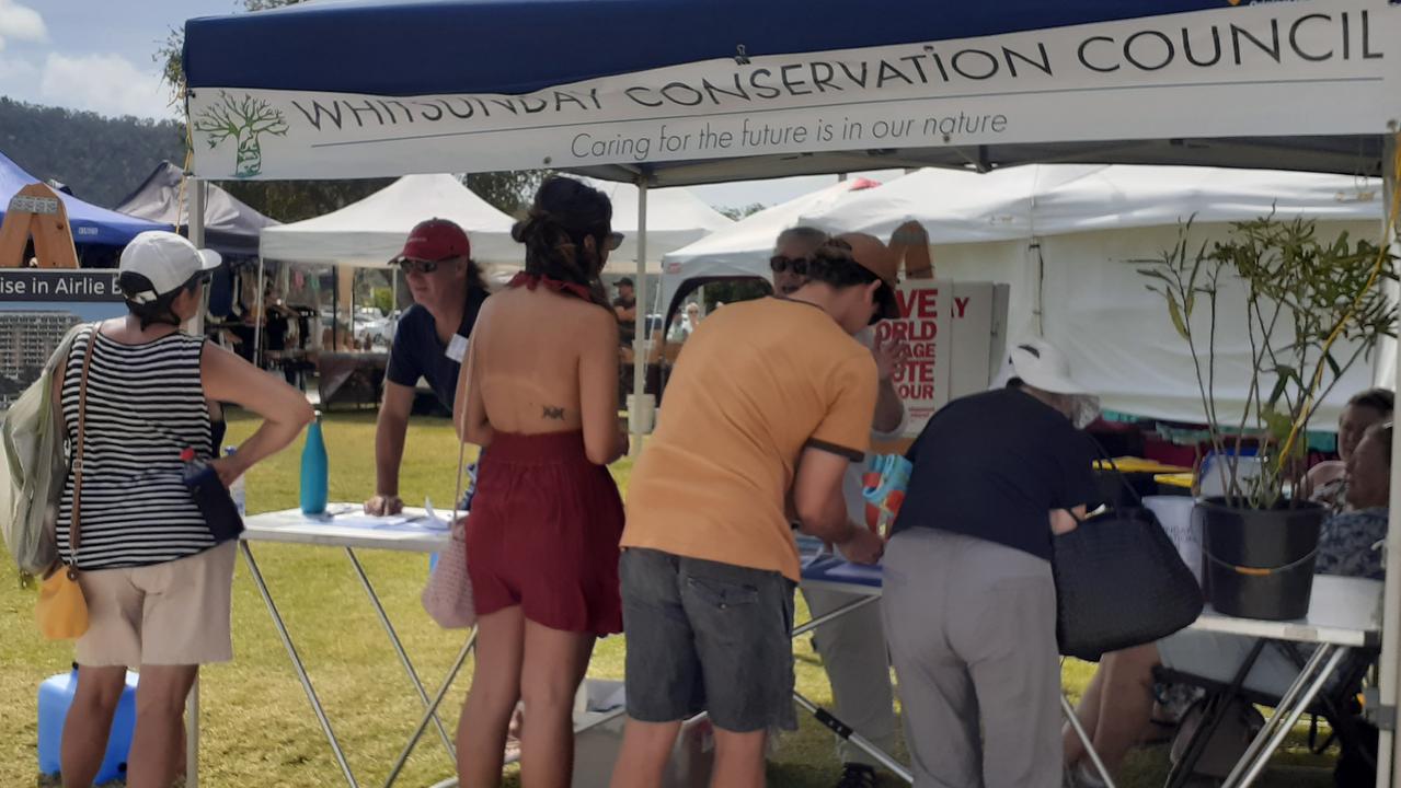 The Save of Foreshore group collected submissions against the proposed Port of Airlie 12-storey resort at the Airlie Beach markets. Picture: Supplied