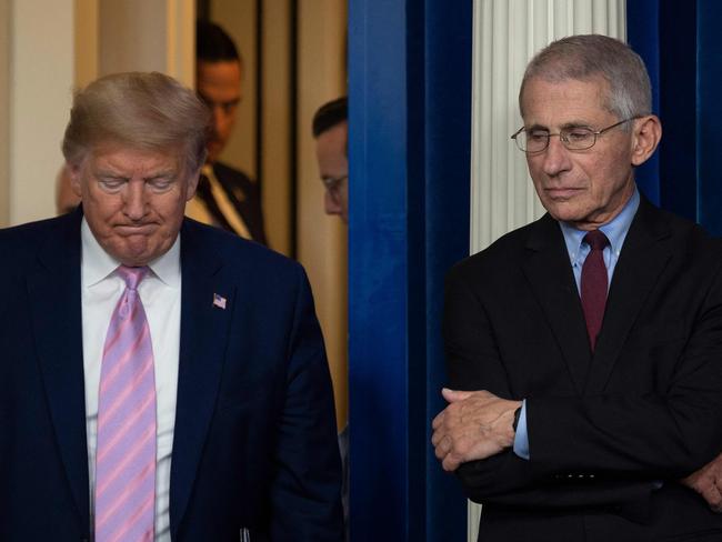 (FILES) US President Donald Trump arrives as Director of the National Institute of Allergy and Infectious Diseases Dr. Anthony Fauci looks on during a Coronavirus Task Force press briefing at the White House in Washington, DC, on April 4, 2020. US President Joe Biden on January 20, 2025, issued pre-emptive pardons to former medical advisor Anthony Fauci, retired general Mark Milley, and members, staff and witnesses of a House committee investigating the US Capitol attack of January 6, 2021. (Photo by JIM WATSON / AFP)