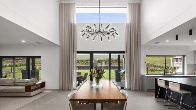 A chandelier hangs from the vaulted ceiling above the dining area at 31 Millpond Lane, Batesford.