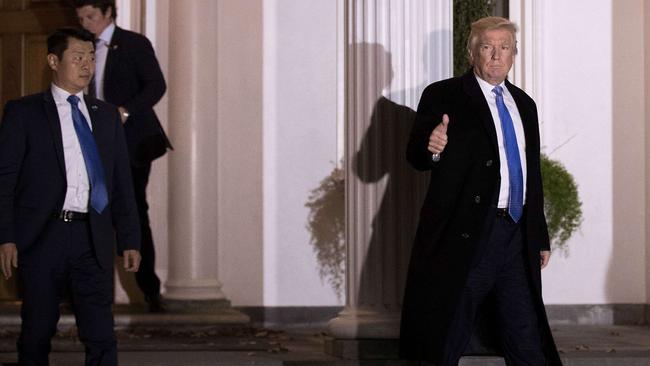 Donald Trump with members of the Secret Service. Picture: AFP