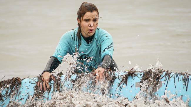 Rachael Leahcar wipes out in the weedy shorebreak. Picture: Mike Burton