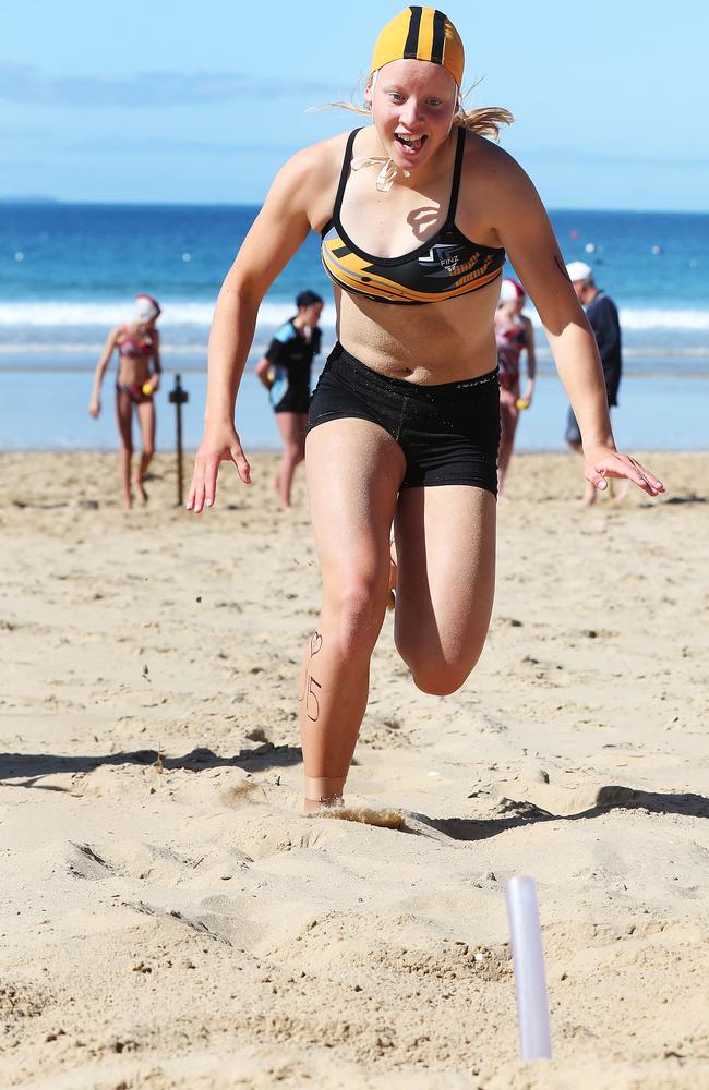 Phoebe Woodhouse 15 of Burnie Surf Life Saving Club competing in the u/15 beach flags. Tasmanian Surf Lifesaving Championships at Clifton Beach. Picture: NIKKI DAVIS-JONES