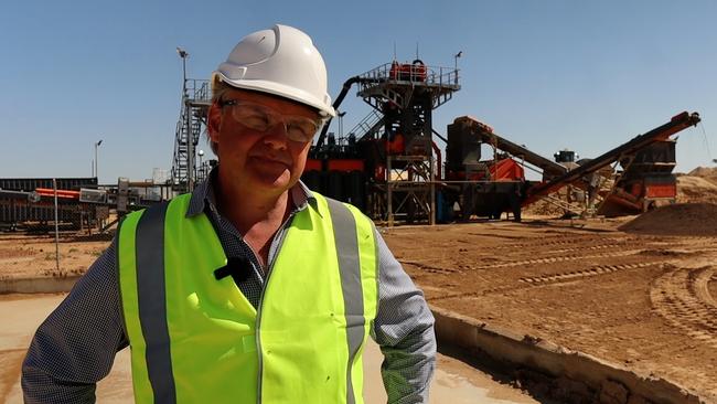 Centrex CEO Robert Mencel stands in front of the phosphate rock processing plants at Ardmore near Mount Isa.