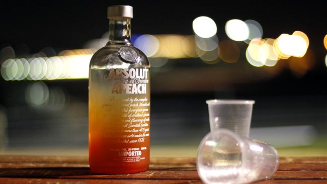 An Absolut Vodka bottle is all that remains on a park bench in North Bondi. A Daily Telegraph story on young people and drinking alcohol. Generic, drunk, drinking.