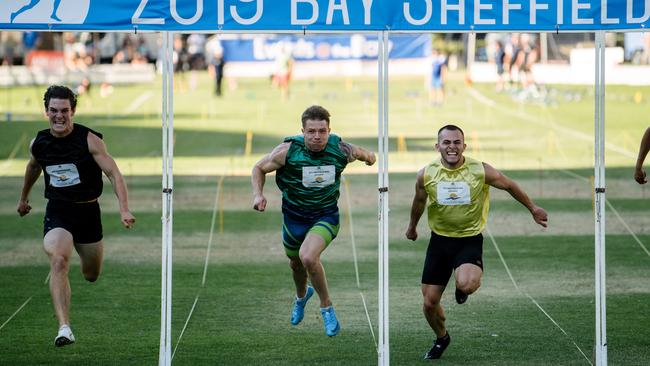 Tomas Semmler, right, wins the 2019 Men’s Bay Sheffield from Calum Scrivens, left, and Tom Sclanders at Colley Reserve. Picture: AAP Image/ Morgan Sette