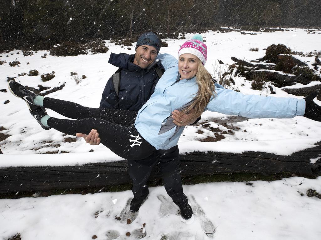 Chris and Michelle Parker of Brisbane enjoy the snow at Cradle Mountain. PICTURE CHRIS KIDD