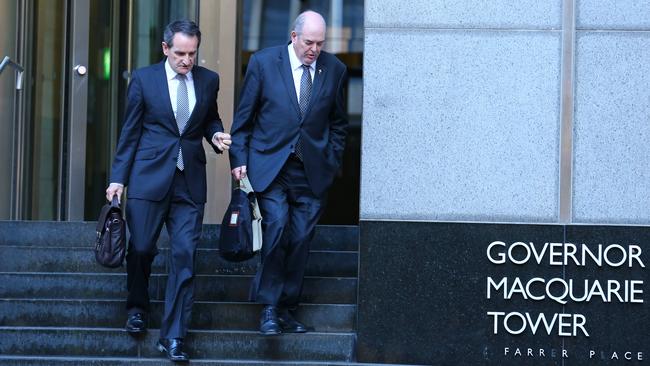 Francis Sullivan (left), chief executive of the Catholic Church's Truth, Justice and Healing Council with Father Brian Lucas (right) former general secretary of the Australian Catholic Bishops Conference, leaves Governor Macquarie Tower in Sydney with his lawyer after appearing on the stand at the Royal Commission into Institutional Responses to Child Sexual Abuse. Picture: Britta Campion/The Australian