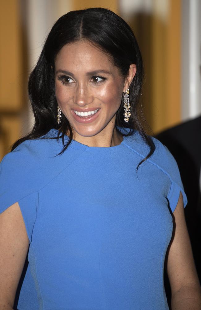 Meghan paired her dress with stunning diamond earrings. Picture: AP