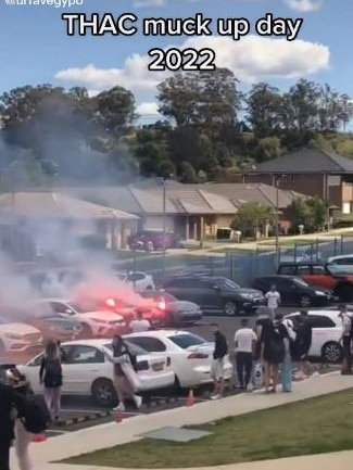 Students from a NSW school set off flares in the car park. Source: TikTok