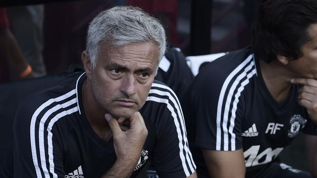 José Mourinho (L) of Manchester United looks on