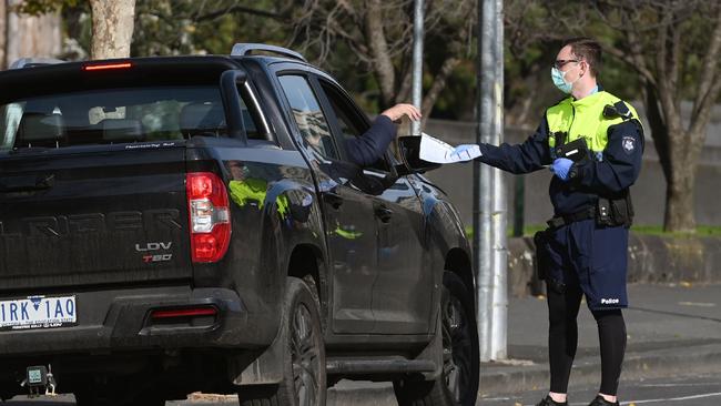 Police officers are checking people are complying with Stage 4 restrictions in Melbourne. Picture: William West