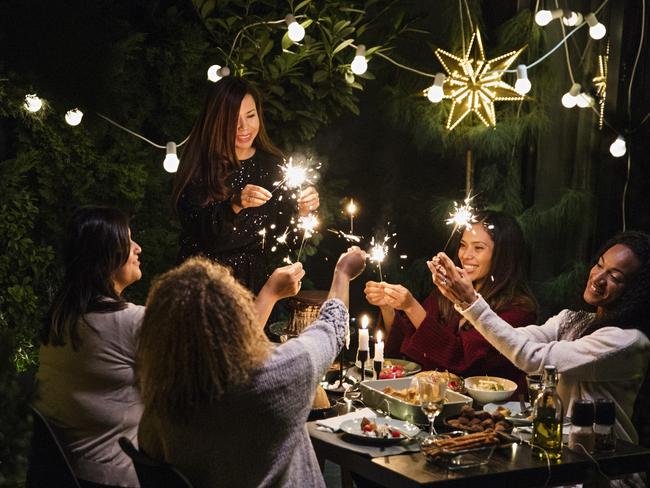 Latino women have dinner party at house yard