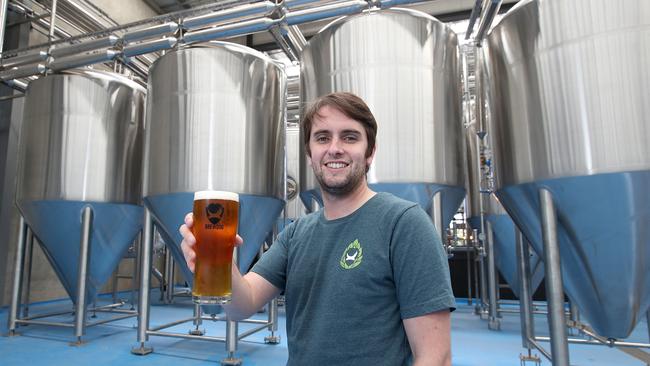 Brewdog Operations manager Australia Calvin McDonald toasts the opening of Brewdog Murrarie. Picture: AAP/Jono Searle