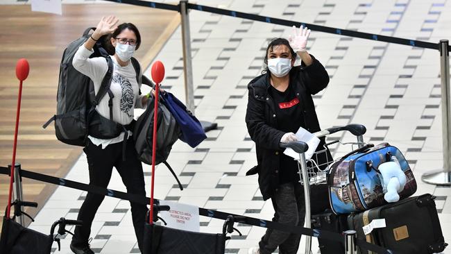 Face masks look set to become a standard feature of air travel. Picture: AAP