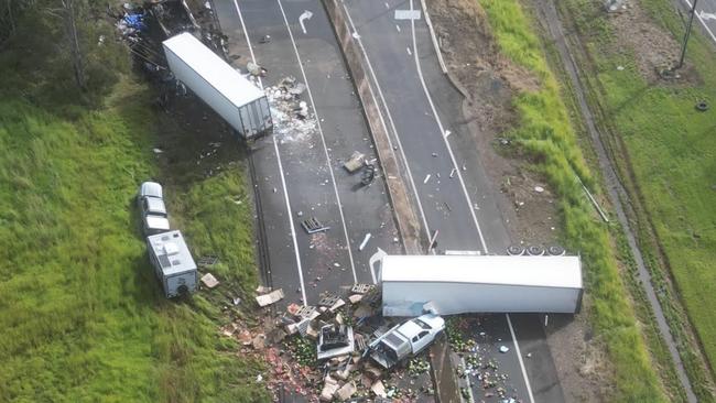 An aerial photo shows the devastating scene in which at least three people died in a five vehicle crash on the Bruce Highway near Maryborough. Photo: Michael O'Connor