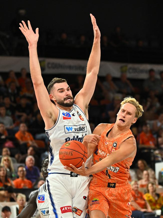 CAIRNS, AUSTRALIA - SEPTEMBER 28: Kyle Adnam of the Taipans in action under pressure from Isaac Humphries of the 36ers during the round two NBL match between Cairns Taipans and Adelaide 36ers at Cairns Convention Centre, on September 28, 2024, in Cairns, Australia. (Photo by Emily Barker/Getty Images)
