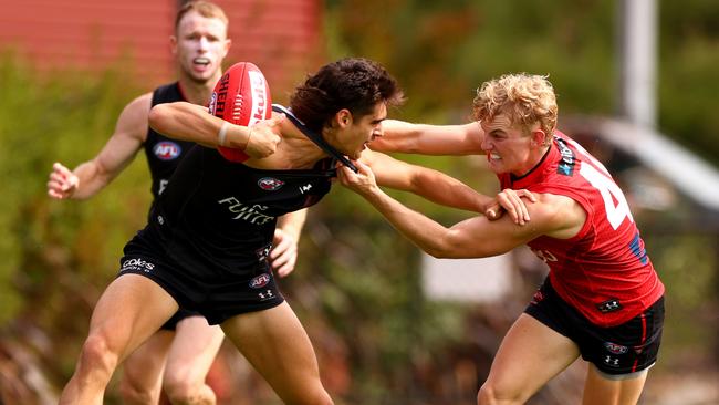 Tom Hird lays a tackle during Essendon’s trial match. Picture: Getty Images