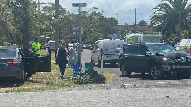 The black SUV Ms Merrett was allegedly driving (right) and the Toyota sedan where the boy was trapped before being freed. Picture: NewsLocal