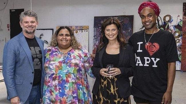 Nick Mitzevich, Sally Scales, SA Arts Minister Andrea Michaels, and Wynne Prize winner Zaacariah Fielding at the APYACC's Adelaide studio.