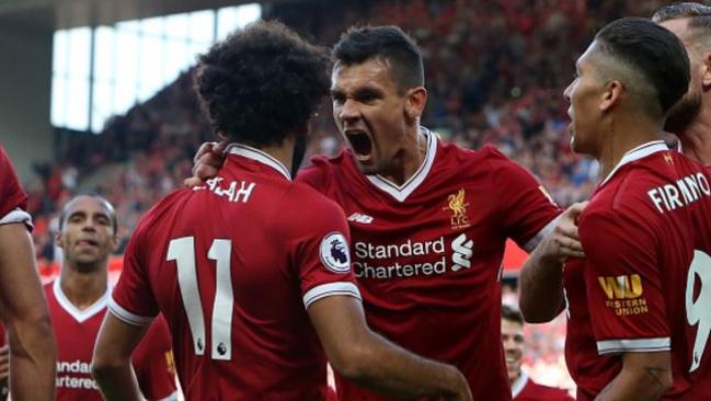 Dejan Lovren and Mohamed Salah celebrate.