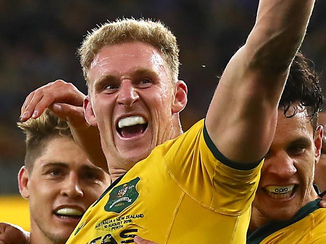 PERTH, AUSTRALIA - AUGUST 10: Reece Hodge of Australia (C) celebrates his try during the 2019 Rugby Championship Test Match between the Australian Wallabies and the New Zealand All Blacks at Optus Stadium on August 10, 2019 in Perth, Australia. (Photo by Cameron Spencer/Getty Images)