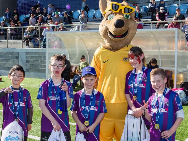 Posing with the football mascot.