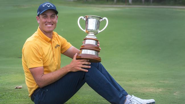 Winner Anthony Quayle proudly shows off the TB Hunter Cup for winning the Queensland Open at Pelican Waters. Photo: David Kapernick