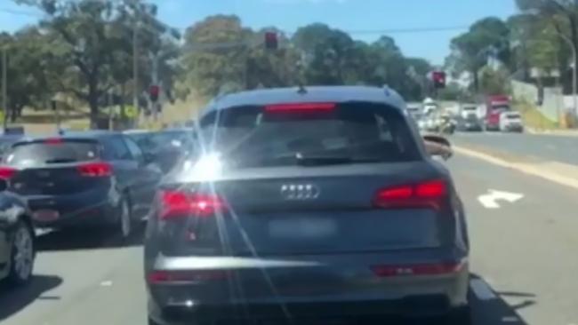 An Audi driver who was filmed dropping a lit cigarette on the M1. Picture: Reddit