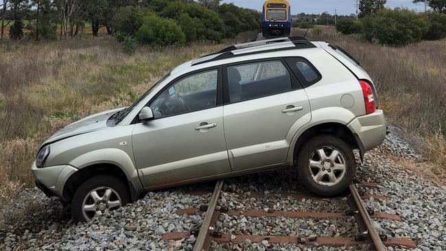 The man allegedly took his boss’s car for a spin and left it on train tracks. Photo: NSW Police