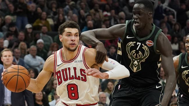 Thon Maker tries to stop Zach LaVine.