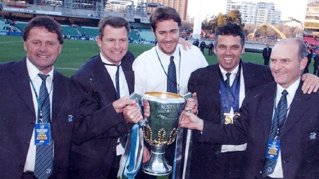 Geoff Morris (far left) was part of Port Adelaide's coaching group during the club's 2004 premiership-winning season.