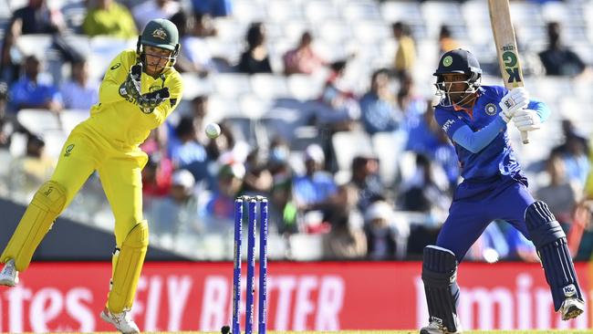 India’s Pooja Vastrakar bats while Alyssa Healy of Australia looks on during the 2022 ICC Women's Cricket World Cup match between India and Australia at Eden Park on March 19, 2022 in Auckland, New Zealand. Picture: Hannah Peters/Getty Images