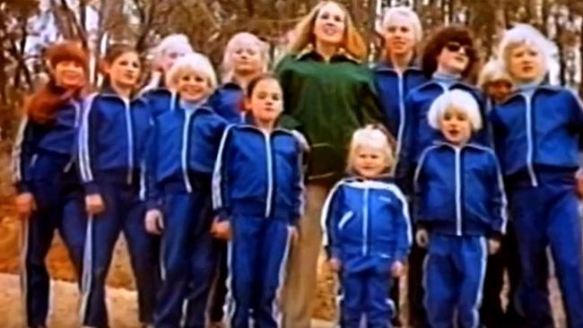 Children from the cult ‘The Family’, dressed in identical tracksuits, some with bleached hair.