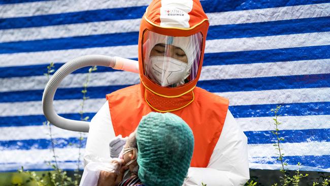 A health worker conducts a Covid-19 test in Bangkok, Thailand. Picture: AFP