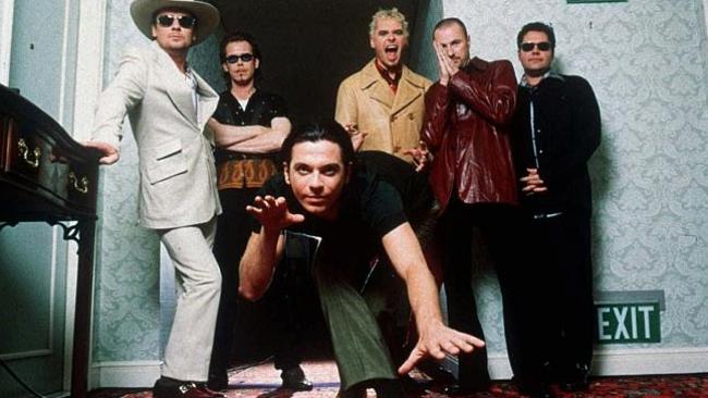 INXS in 1997 from left, Tim Farriss, Kirk Pengilly, Michael Hutchence, foreground, Jon Farriss, Garry Gary Beers and Andrew Farriss.