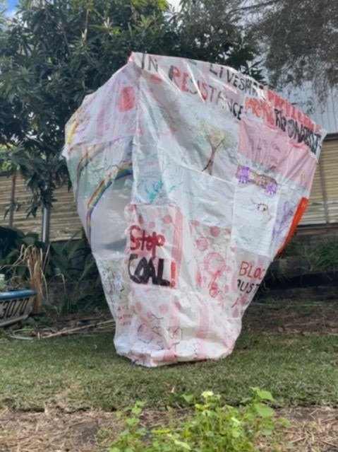 Climate activists built a 'Stop Hot Air Balloon' for the Ekka Outdoor Sculpture competition from reclaimed plastic bags, but it was beaten by a sculpture of a digger.