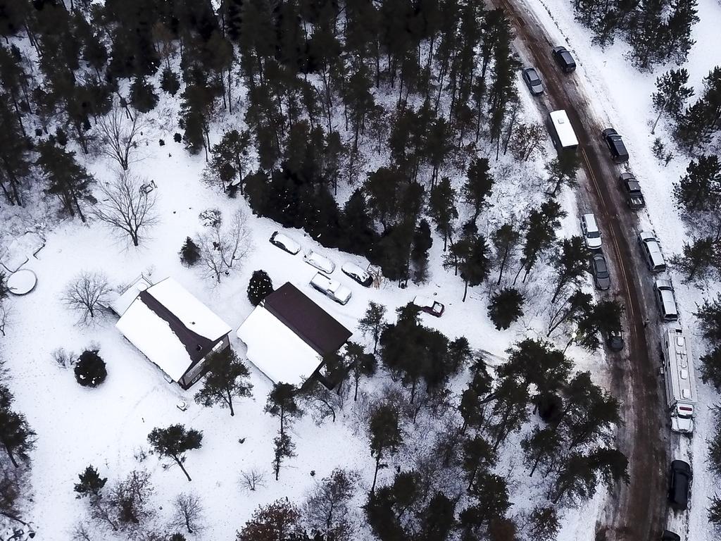 Law enforcement vehicles surrounding the home of Jake Patterson in Gordon, Wisconsin. Picture: Aaron Lavinsky via AP