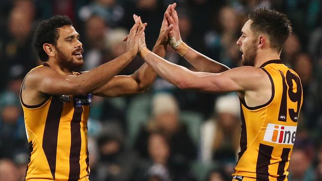 ADELAIDE, AUSTRALIA — JULY 07: Cyril Rioli and Jack Gunston of the Hawks celebrate a goal during the round 16 AFL match between the Port Adelaide Power and the Hawthorn Hawks at Adelaide Oval on July 7, 2016 in Adelaide, Australia. (Photo by Morne de Klerk/Getty Images)