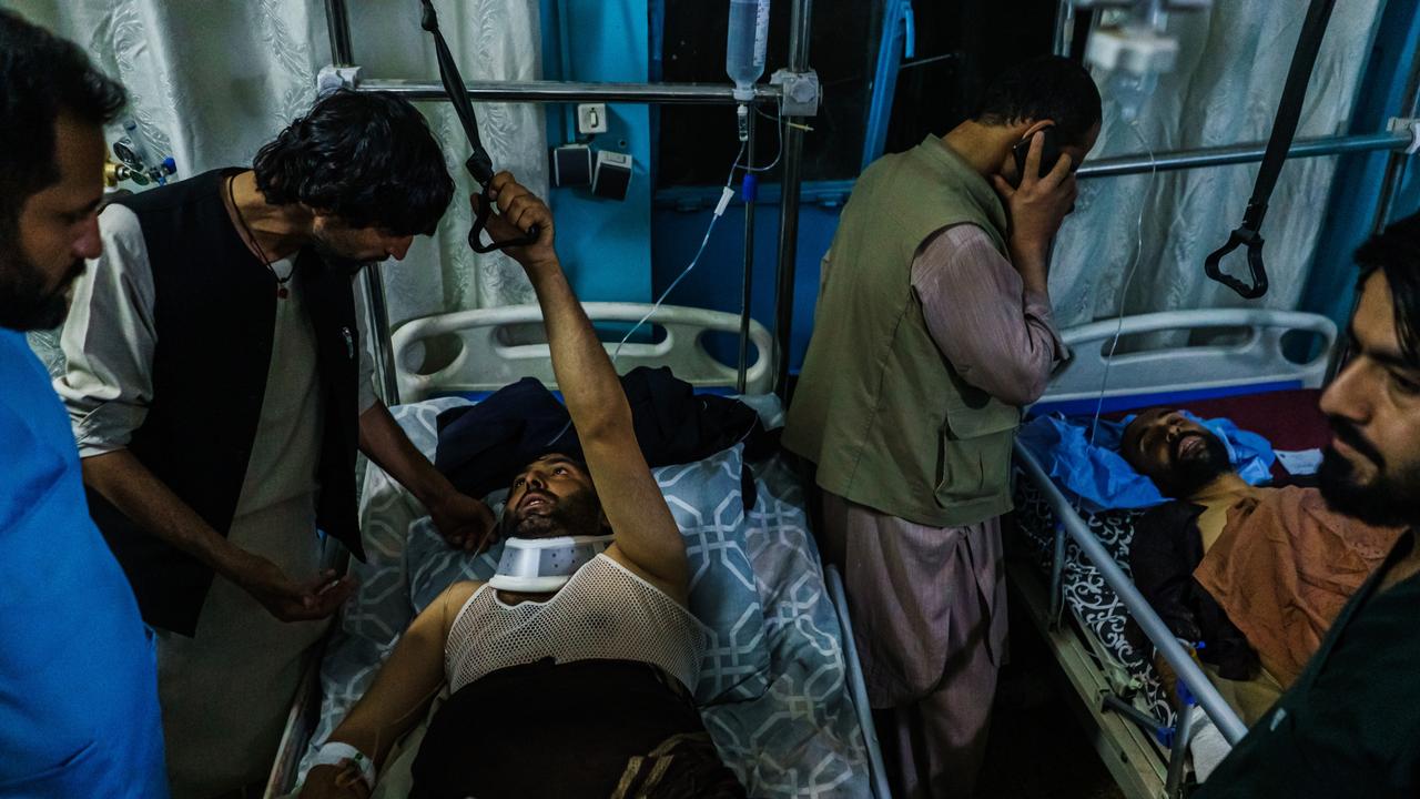 Family members visit wounded patients who have been admitted into Wazir Akbar Khan Hospital in Kabul, Afghanistan. Picture: Marcus Yam/Los Angeles Times