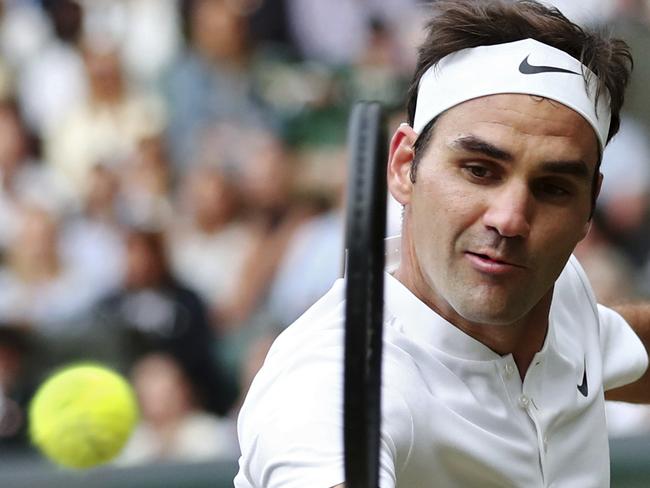 Switzerland's Roger Federer returns to Czech Republic's Tomas Berdych during their Men's Singles semifinal match on day eleven at the Wimbledon Tennis Championships in London, Friday, July 14, 2017. (Gareth Fuller/Pool Photo via AP)