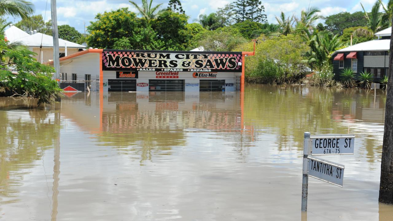 RECEDING WATER: Rum City Mowers and Saws in George Street slowly emerges from the receding flood waters during the 2013 floods in Bundaberg. Photo: Mike Knott / NewsMail