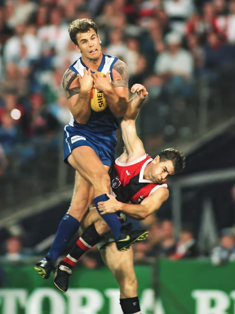 1996: North Melbourne star Wayne Carey takes a mark over St Kilda’s Steven Sziller at Waverley Park.