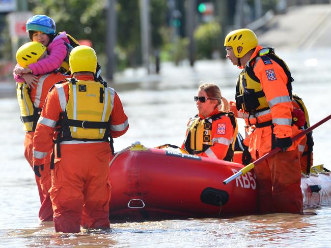 MELBOURNE, AUSTRALIA - OCTOBER 14TH, 2022: Maribyrnong Floods, Melbourne. Little girl being rescued by the SES at Raleigh Rd.Picture: Nicki Connolly