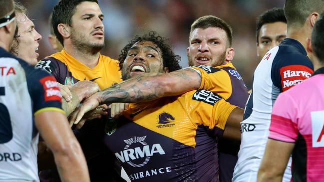 Sam Thaiday of Brisbane is held back by Josh McGuire during the NRL match between the Brisbane Broncos and the North Queensland Cowboys. Pic Darren England.