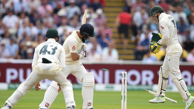 Moeen Ali is knocked over by Nathan Lyon at Edgbaston.