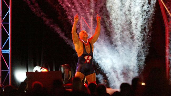 WWE star Kurt Angle enters the arena.