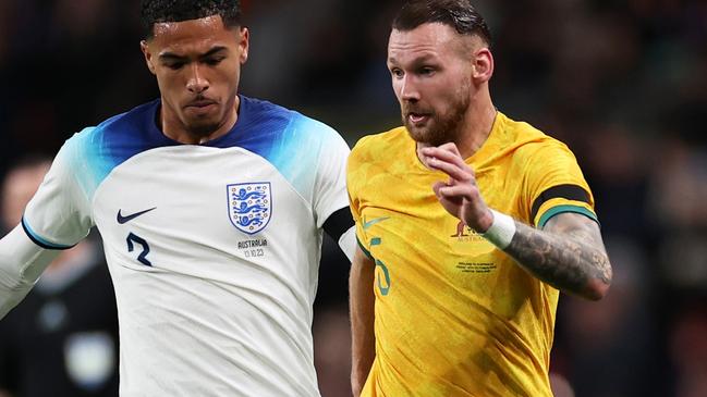 LONDON, ENGLAND - OCTOBER 13: Martin Boyle of Australia is challenged by Levi Colwill of England during the international friendly match between England and Australia at Wembley Stadium on October 13, 2023 in London, England. (Photo by Ryan Pierse/Getty Images)